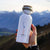 Weiße "ANKERLIFT" Edelstahl Trinkflasche mit Bambusdeckel von ANKERLIFT vor Bergpanorama